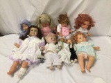 9x vinyl and plastic dolls. Playmates and more. Largest doll measures approximately 22x12x6 inches.