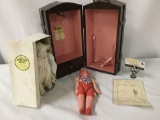 Lot consisting of a 1991 doll trunk, a vintage papier-mche doll, and a handmade antique bisque baby