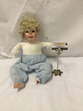 1991 E.T. Turner Michelle Hand Numbered porcelain doll. 1385E. Missing hands and has broken foot.