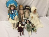 7x composite, porcelain, and vinyl dolls. Berjusa and more. Largest doll measures approximately