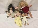 5x composite, vinyl and porcelain dolls. Disney and more. Largest doll measures approximately