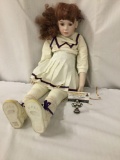 Large 1992 Porcelain doll in University of Washington attire. Made by Jon Garnett of Jubilee Mold