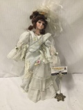 Limited edition Dan Fa porcelain doll. 1-500. Measures approximately 18x10x4 inches.