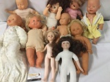 Lot of ten porcelain and vinyl baby dolls; Tyco, Linimax Toys, Cititoy. Largest doll approx. 13x18x5