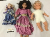 Three porcelain and Vinyl Dolls, two unmarked dolls and one from Gender Images. Largest is approx.