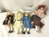 Five vintage porcelain dolls by Enesco, DanDee, and others. Largest doll approx. 12x18x4 inches. JRL