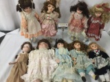 Nine vintage porcelain dolls, several of which are from JCPenny. Approx. 9x17x3.5 JRL