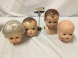 4x composite vintage doll heads. Largest measures approximately 9x5x6 inches.