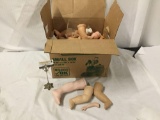 Open box lot of doll limbs. Vinyl composite porcelain box measures approximately 16x12x12 inches.