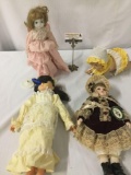 Lot of four porcelain and vinyl dolls from Geppeddo and others. Largest doll is approx. 16x19x4