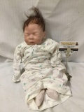 Sheila Michael realistic vinyl newborn baby doll. Measures approximately 17x11x5 inches.