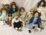 Ten porcelain and wood dolls from makers like Geppeddo, Paradise Galleries, and Franklin Heirlooms.