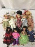 Nine multicultural porcelain dolls, including three hats and three shoes. From makers like House of