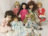 Seven unmarked porcelain dolls. Largest doll is approximately 7x16x3 inches. JRL