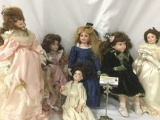 Six porcelain and composite dolls from makers like the Curie Collection. Largest doll approx. 8x20x4