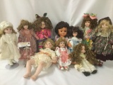 Ten porcelain and vinyl dolls from makers like DanDee, Ann Timmerman, Showstoppers, and others. JRL