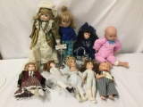 9x porcelain, composite and vinyl dolls. Batter and more. Largest doll measures approximately