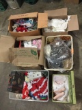 Open box lot. 6 boxes of doll clothes, doll wigs, and porcelain doll parts. Largest box measures