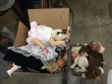 Open box lot. 2 boxes of broken dolls and doll parts. Larger box measures approximately 24x18x18