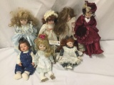 7x porcelain and composite dolls. Mann and more. Largest doll measures approximately 19x8x4