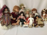 Nine porcelain and composite dolls from makers like Horseman, DanDee and others. Largest doll is