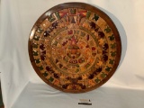 Stunning wood carved and inlaid round Mayan calendar art piece with info sheet on backside