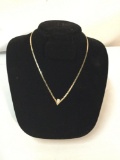14k yellow gold necklace feat. a diamond, marked 14k - weighs 11 grams