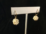 Pair of 14k gold earrings feat. a pearl cluster marked JCM 14k - 3.4 grams ttw
