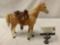 Vintage Breyer plastic horse toy with leather saddle, approx 11x10 inches