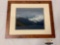 Framed photograph of snow capped mountains with lake in the foreground, approximately 23 x 19 inches