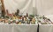 Huge lot of plastic model diorama buildings, structures, towers, and bits. Approx 26x19x17 inches.