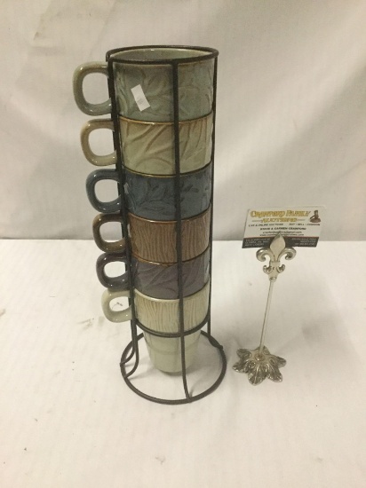 6 Ceramic MercAsia stacking mugs in a wire rack. The whole rack measures approximately 15x5x5