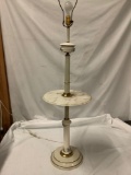 Standing lamp with floral design and marble shelf, works, approx 56x15 inches.