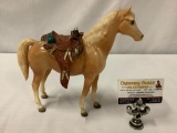 Vintage Breyer plastic horse toy with leather saddle, approx 11x10 inches