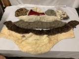 Lot of antique fur wraps, hats, tails.