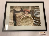 Framed photograph of woman in Sumatra weaving baskets, signed by artist - Howard Koons, 2009,