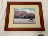 Framed photograph of ancient city with camel in foreground, approximately 24 x 20 inches.