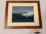 Framed photograph of snow capped mountains with lake in the foreground, approximately 23 x 19 inches