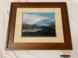 Wood framed photograph of a glacier in mountains, approx 25x21 inches.