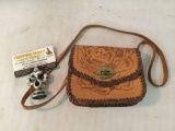 Stamped and tooled leather purse. It measures approximately 6x5x2 inches.