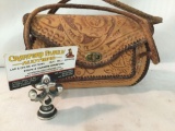 Stamped and tooled leather purse. It measures approximately 9x6x4 inches