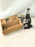 Vintage Wollensack microscope with case and 2 slides. It measures approximately 7.5x3x3.5 inches.