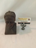 Wood bust sculpture of woman in bonnet. Measures approximately 6x4x3 inches.