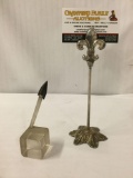 Antique Iron arrowhead having a raised mid-rib, includes plastic display stand