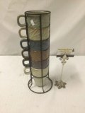 6 Ceramic MercAsia stacking mugs in a wire rack. The whole rack measures approximately 15x5x5