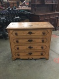 Vintage four drawer dresser with floral pattern. Measures approximately 39x35x17 inches.