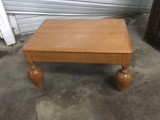 Unique legged vintage coffee table with drawer. Measures approximately 38x19x28