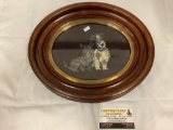Oval framed embroidery piece of two dogs, approximately 14 x 12 inches