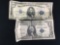 Collection of 2 Red Seal American bills. A 1934 $5 bill and a 1935 $1 bill