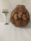 Large earth tone design Native American vase marked Tiqua on the bottom